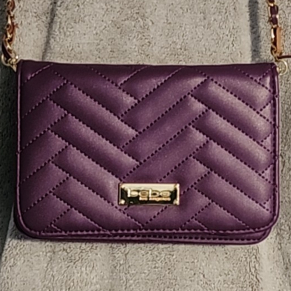 Compact faux leather crossbody.